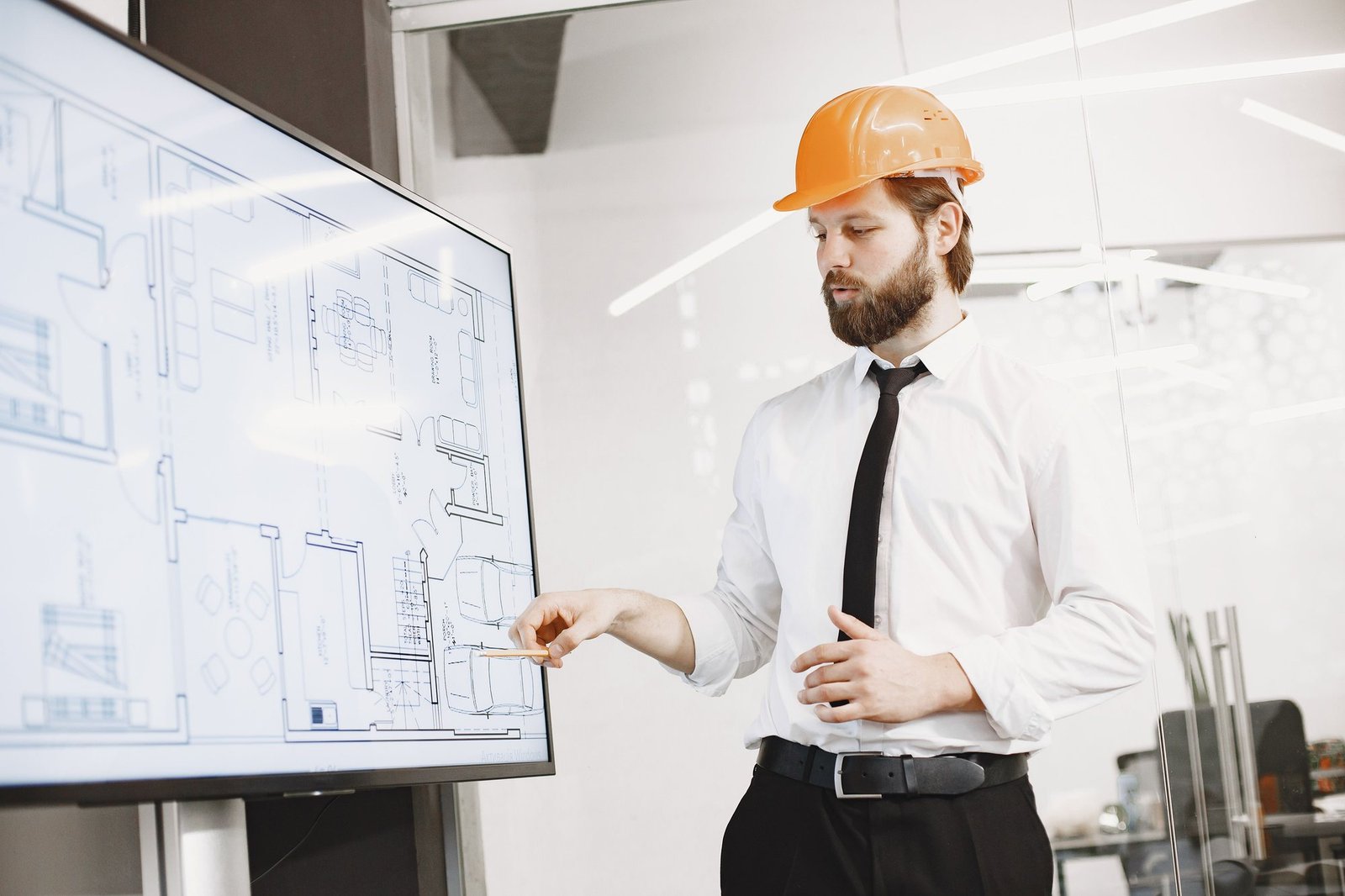 Construction professional reviewing technical plans